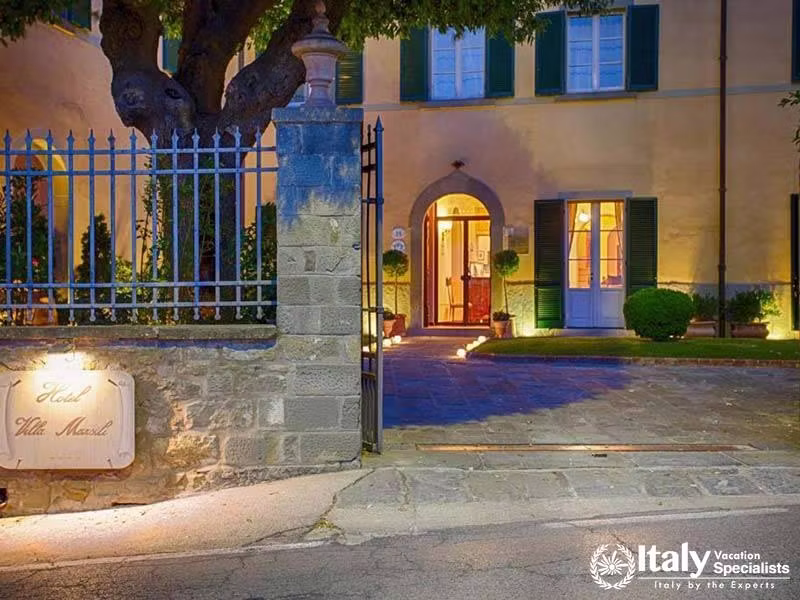 Beautifully Lit Exterior of Hotel Villa Marsili in Cortona, Italy