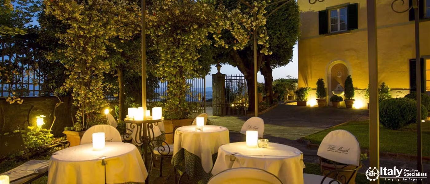 Outdoor sitting at night with beautiful ambience and views in Villa Marsili