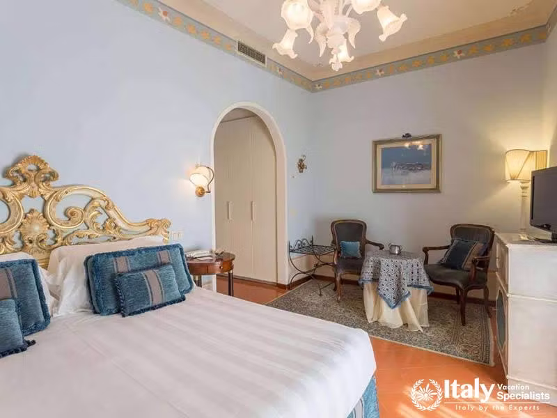 Serene Blue-Toned Room with Luxurious Furnishings at Hotel Villa Marsili in Cortona, Italy