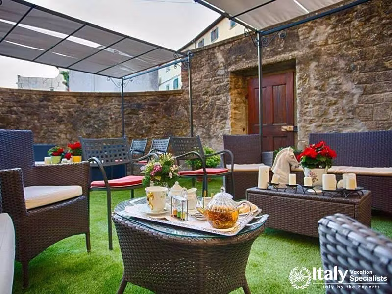 Inviting Outdoor Lounge with Cozy Seating at Hotel Villa Marsili in Cortona, Italy