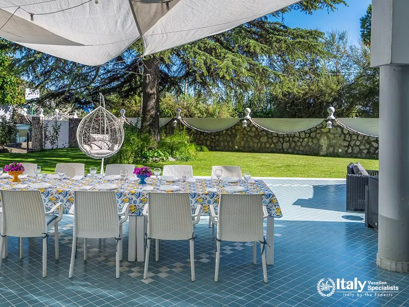 Outdoor Dining Area Under Shade in Villa del Mar, Marina del Cantone