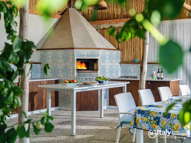 Outdoor Pizza Oven and Dining Area in Villa del Mar, Marina del Cantone