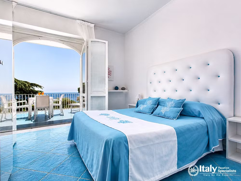 Relaxing Blue-Toned Double Bedroom at Villa del Mar with a Sea-View Terrace