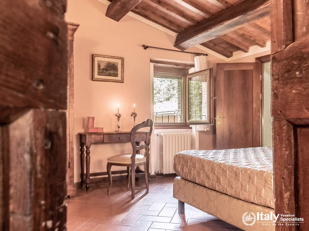 Charming Rustic Bedroom with Garden Views at Villa Buccelletti