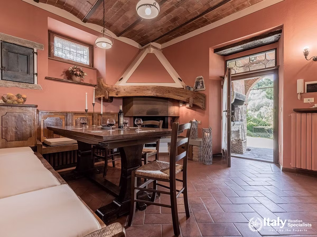Traditional Tuscan Dining Room with Fireplace at Villa Buccelletti