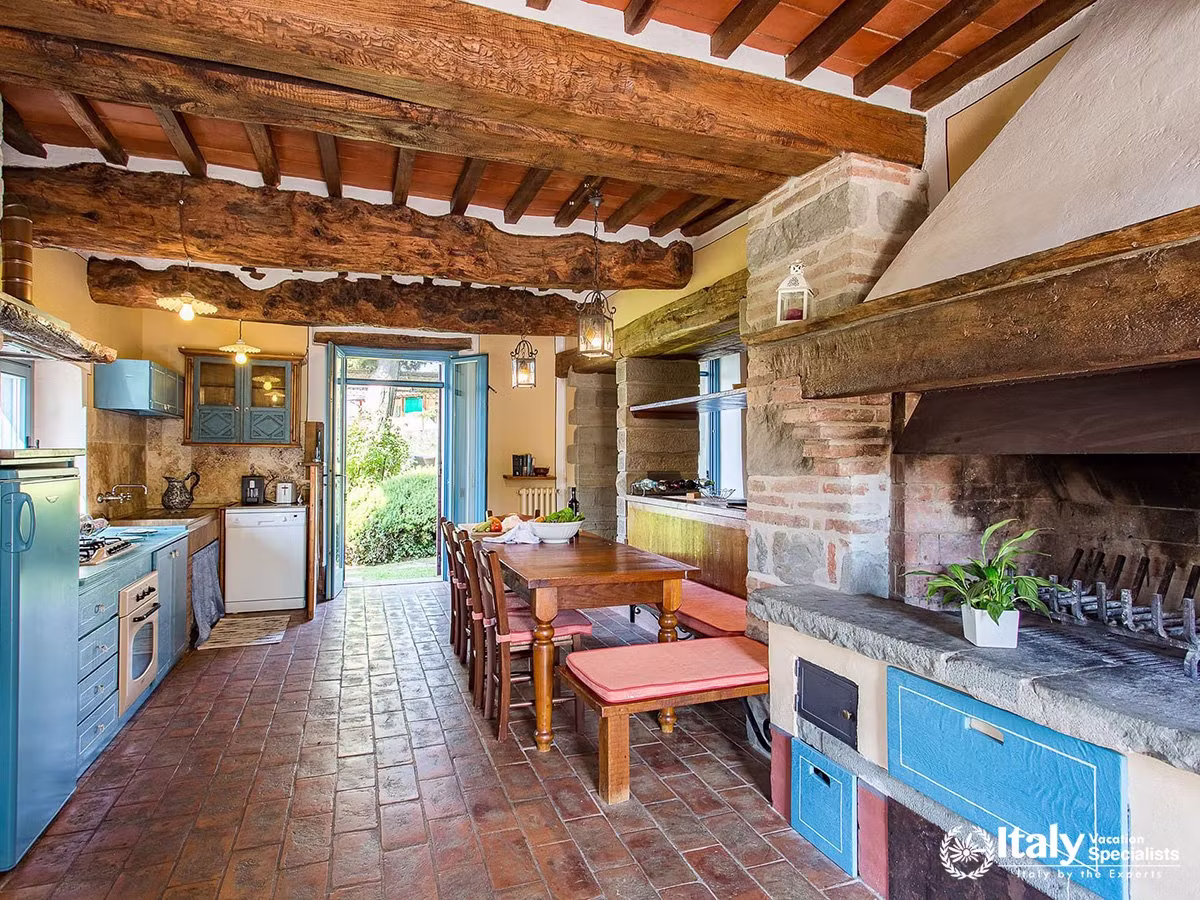 Traditional Kitchen with Fireplace at Villa San Martino