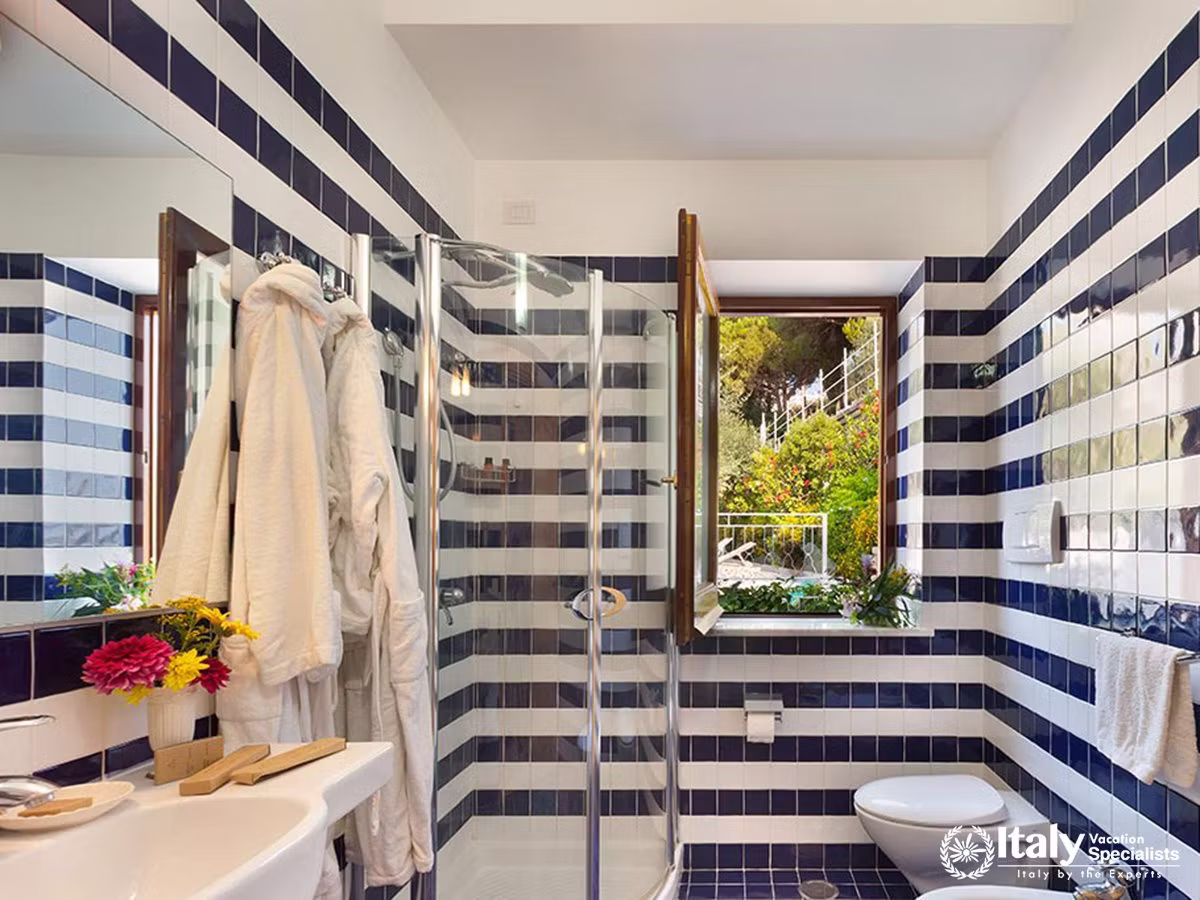 Bright Nautical-Style Bathroom with Garden Views