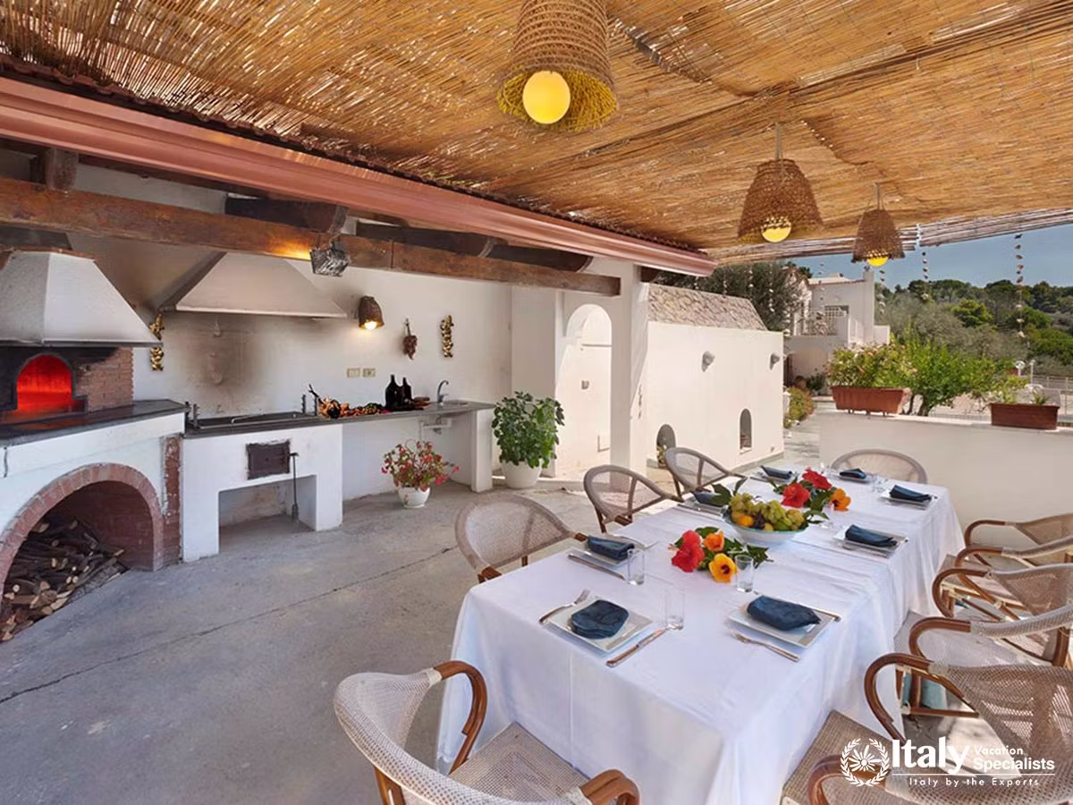 Rustic Outdoor Kitchen and Alfresco Dining Area