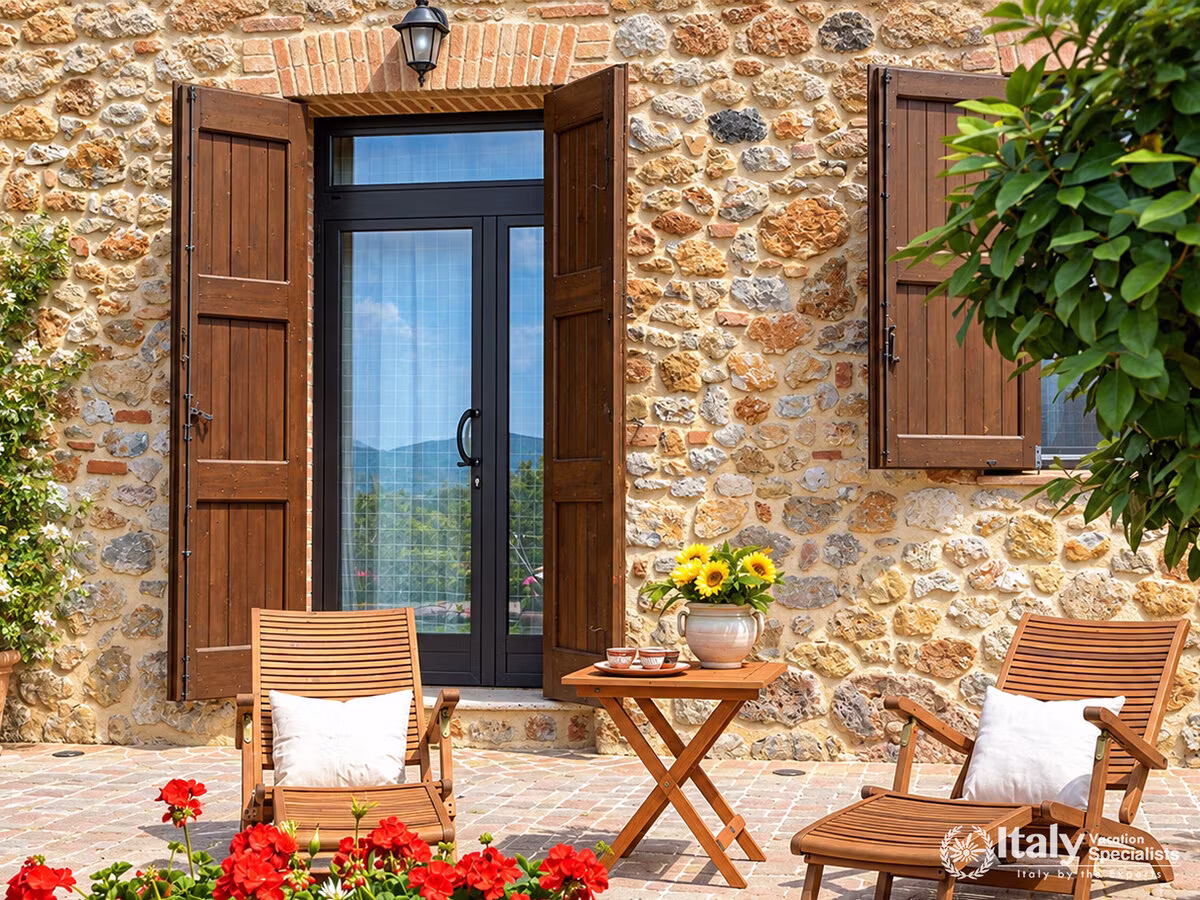 Charming Patio Seating beside Stone Walls