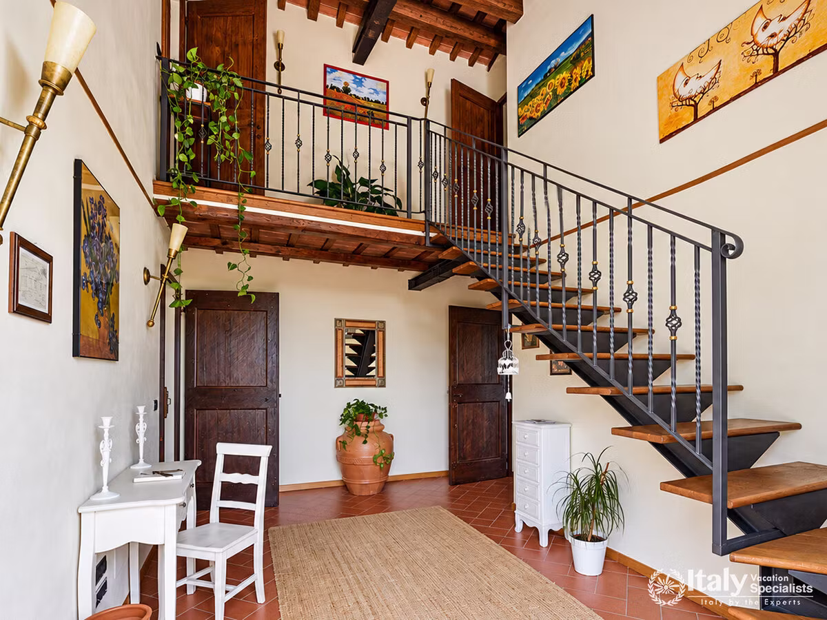 Welcoming Entrance Hall with Rustic Staircase