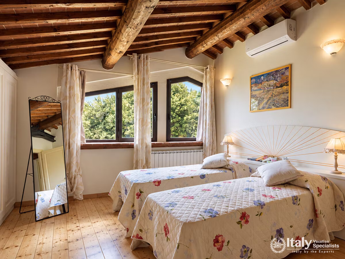 Cozy Twin Bedroom with Exposed Wooden Beams