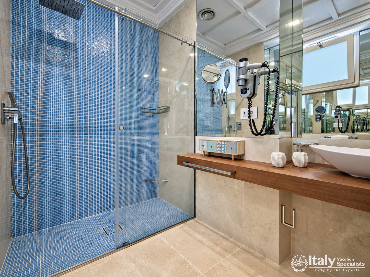 Blue Mosaic Shower and Mirrored Bathroom
