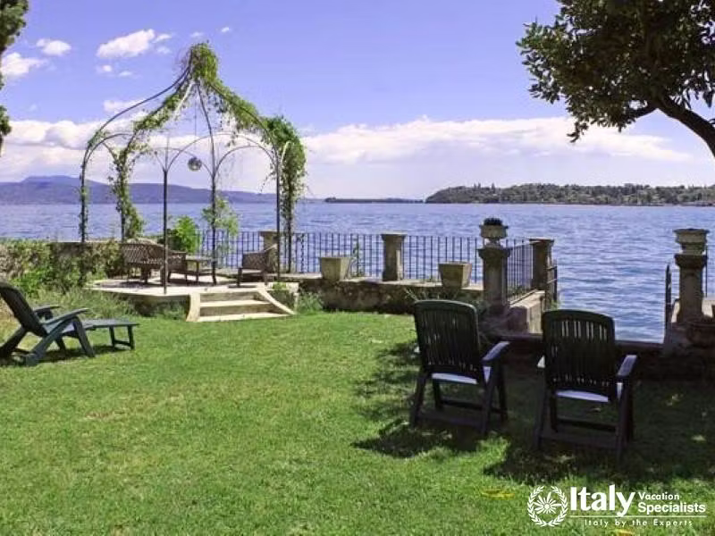 Romantic Lakeside: A serene garden alcove with a vine-wrapped arbor overlooking the tranquil lake.