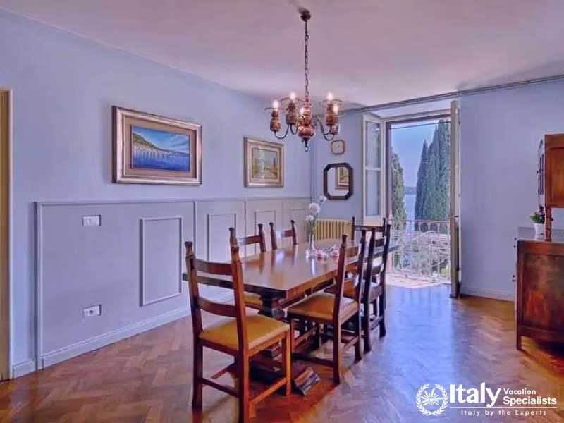 Elegant Dining Room: A sophisticated space with a grand table and garden views from Villa  Elegante