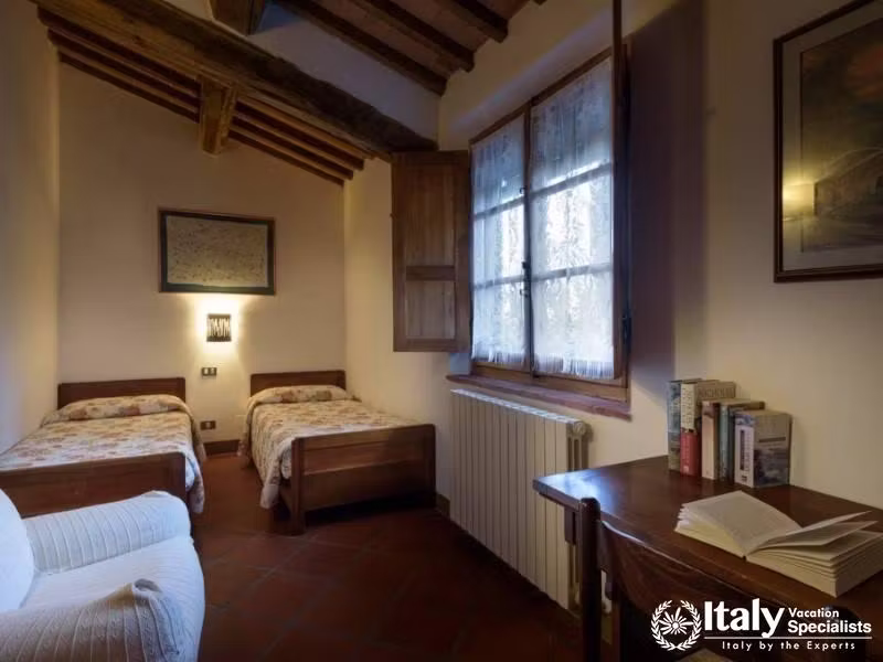 Twin bedroom setup with comfortable beds and a warm, inviting ambiance.