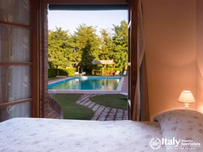 Bedroom with direct pool views, creating a tranquil retreat.
