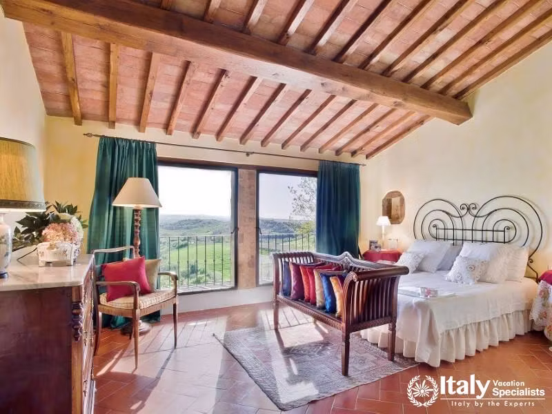 Spacious bedroom with countryside views near Florence, Italy.