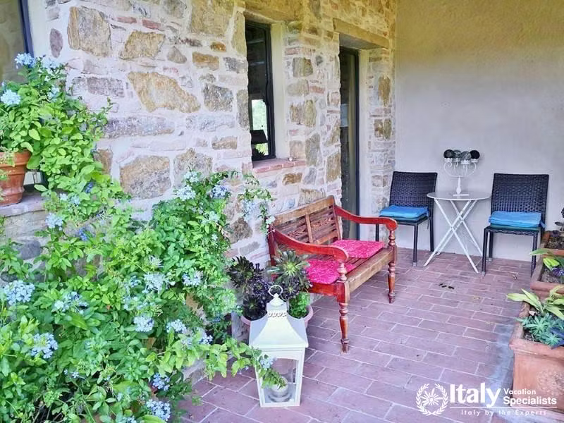 Charming stone porch with plants near Florence, Italy.