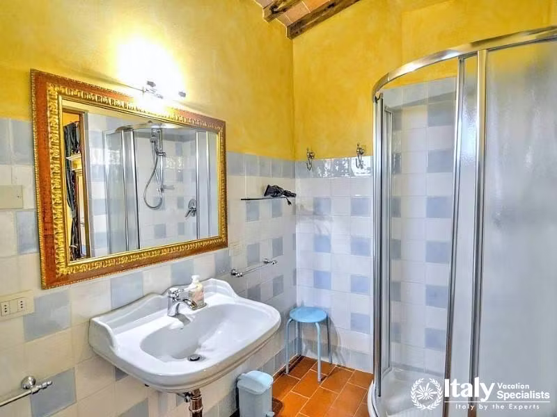 Bright bathroom with rustic charm near Florence, Italy.