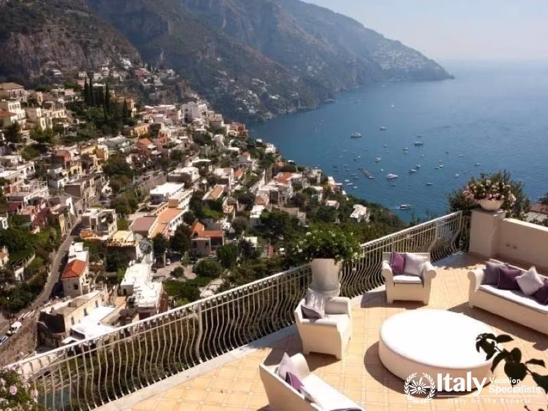 A picturesque terrace offering a stunning view of Positano and the coastline.