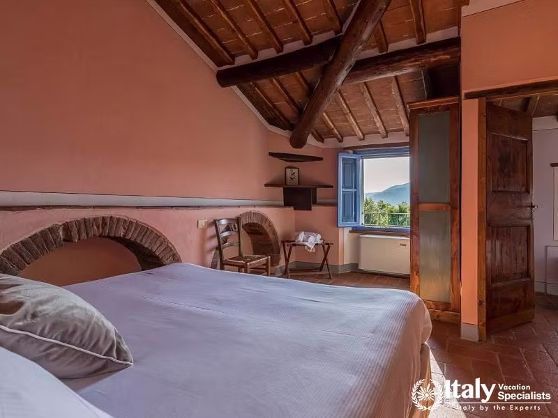 Cozy Bedroom: Rest comfortably in a cozy and charming bedroom.