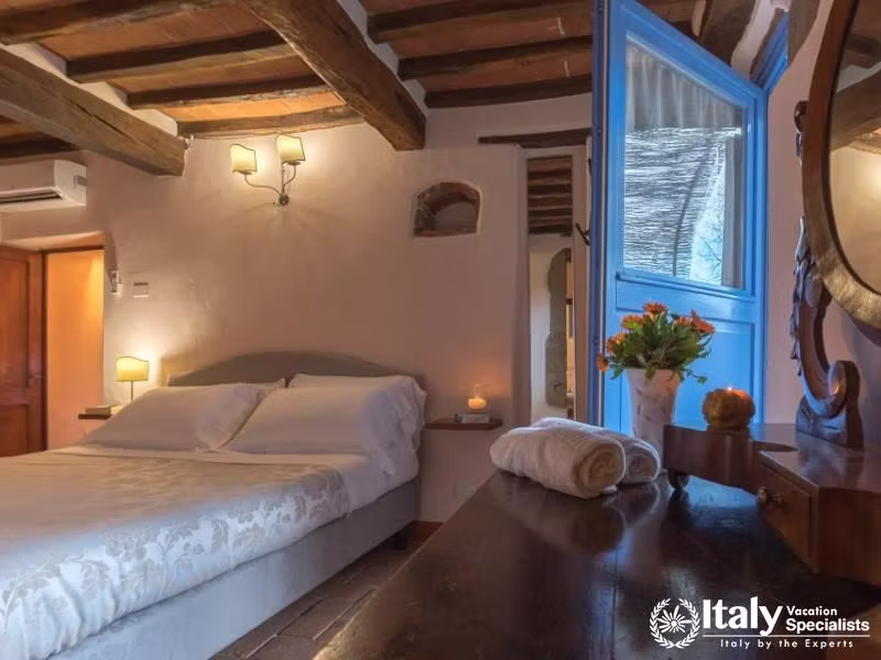 Tasteful bedroom with a touch of rustic elegance.