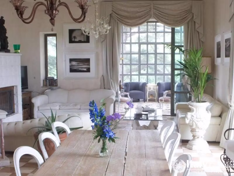 Bright living area with elegant decor and large windows.