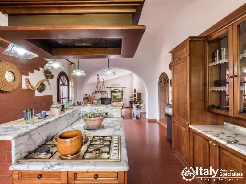 Open-plan kitchen leading to a cozy living area, perfect for relaxation.
