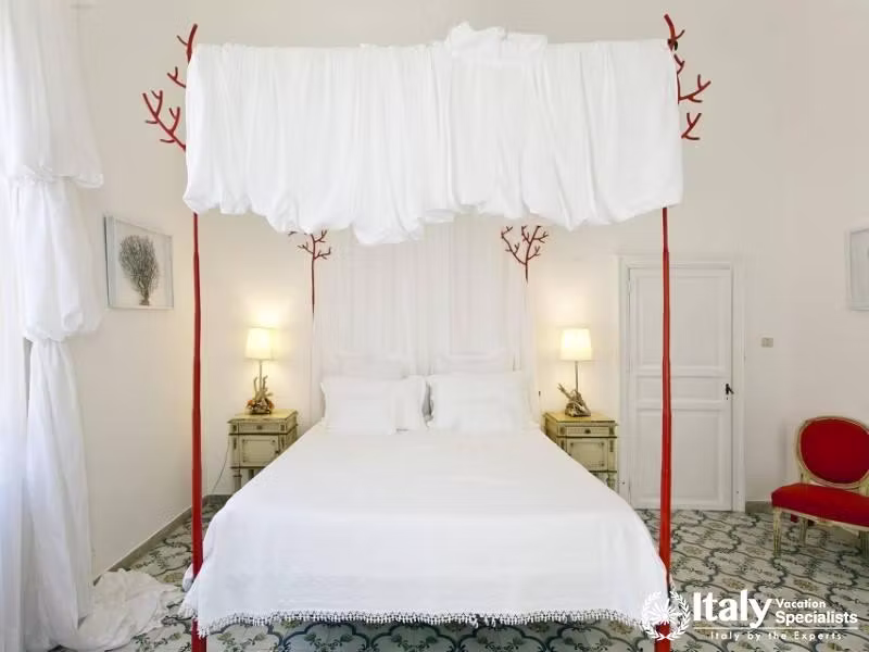 Villa Sole di Marsala features a stylish bedroom with a unique canopy bed.
