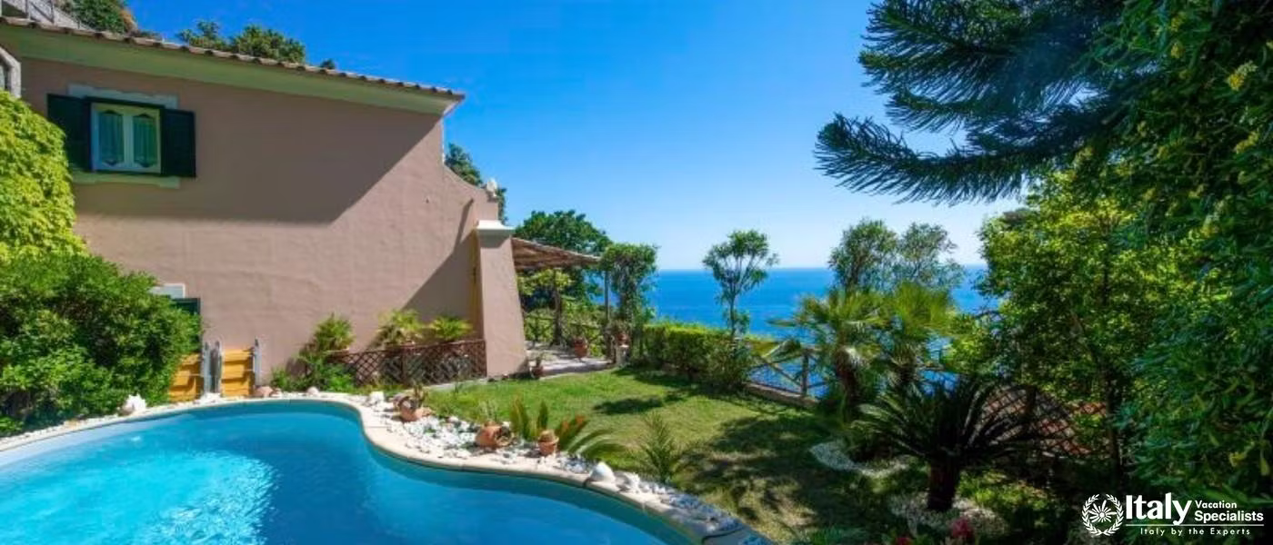 A serene poolside retreat surrounded by lush greenery with breathtaking ocean views.