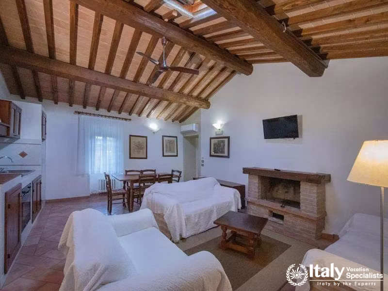 Spacious Living Room with Fireplace and Kitchen at La Dimora del Gazebo in San Gimignano, Italy