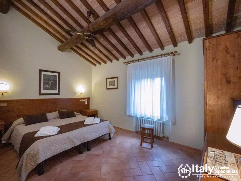 Cozy Tuscan Bedroom with Natural Light at La Dimora del Gazebo in San Gimignano, Italy