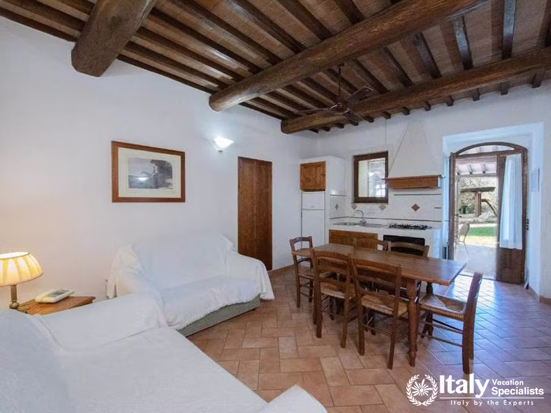Open Living and Dining Area with Garden Access at La Dimora del Gazebo in San Gimignano, Italy
