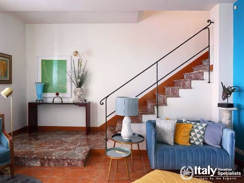 Villa Sontuosos Welcoming Entryway with Chic Staircase in Taormina