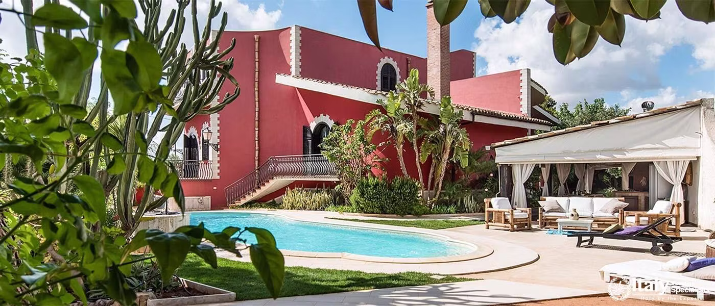 Private pool amidst lush greenery by the villa.