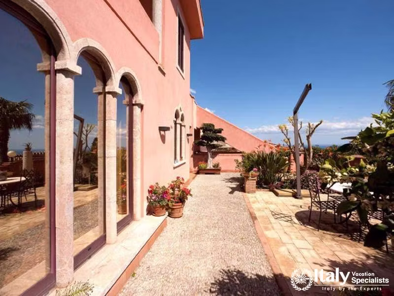 Sunlit Strolls at Villa Sontuosos Elegant Courtyard in Taormina
