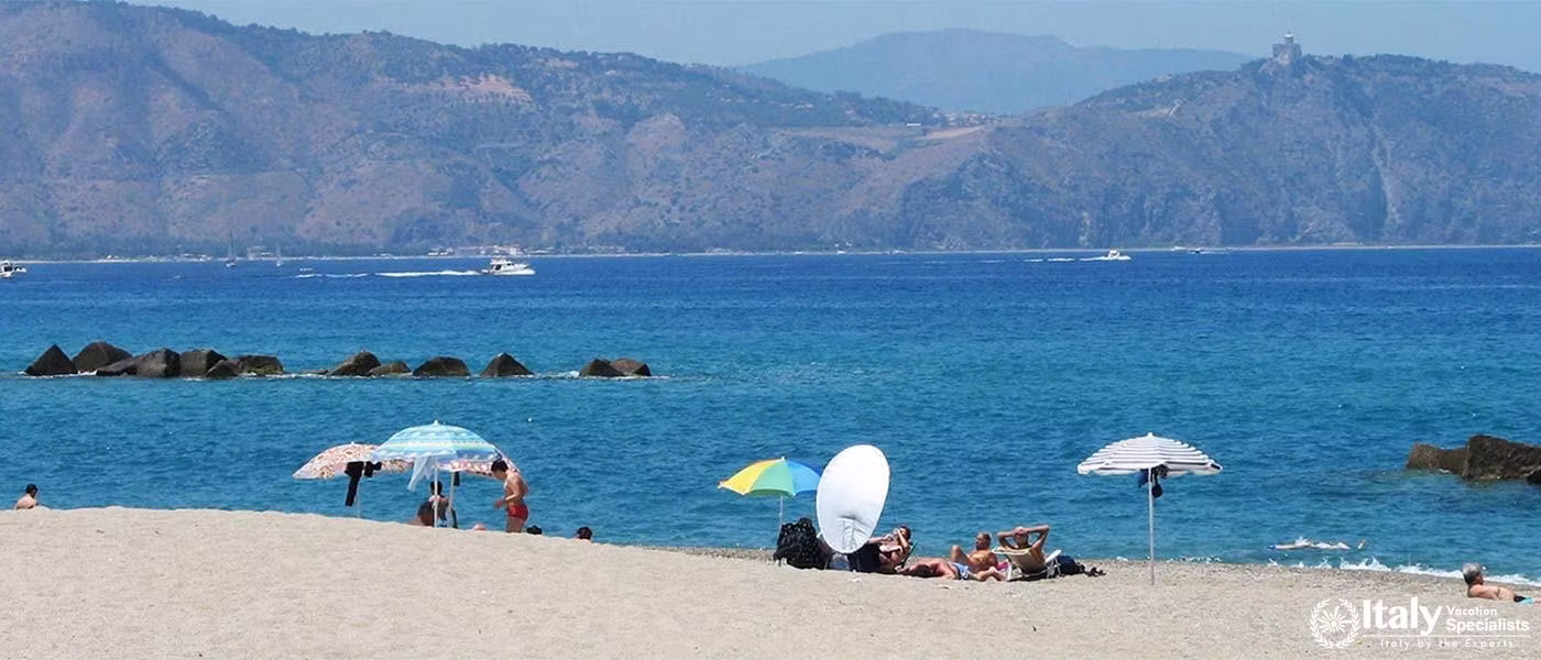Golden sands and clear waters, minutes from the villa.
