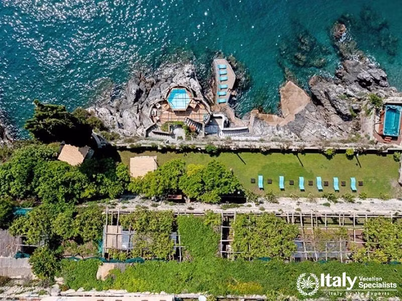 Birdâ€™s-eye view of gardens, pools, and sun decks.