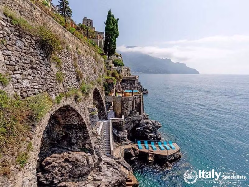 Stone arches and stairways leading to blue waters.