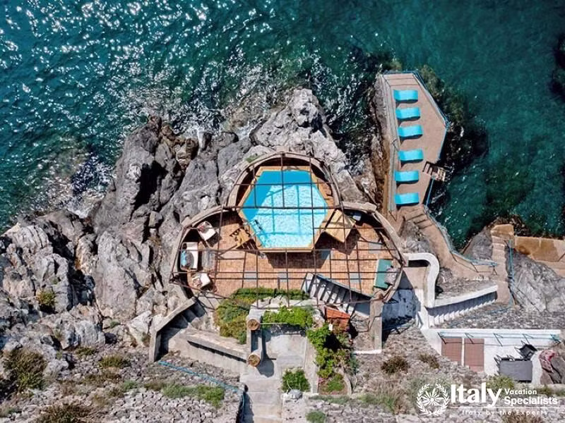 Cliffside pool area with stunning views and seaside luxury.