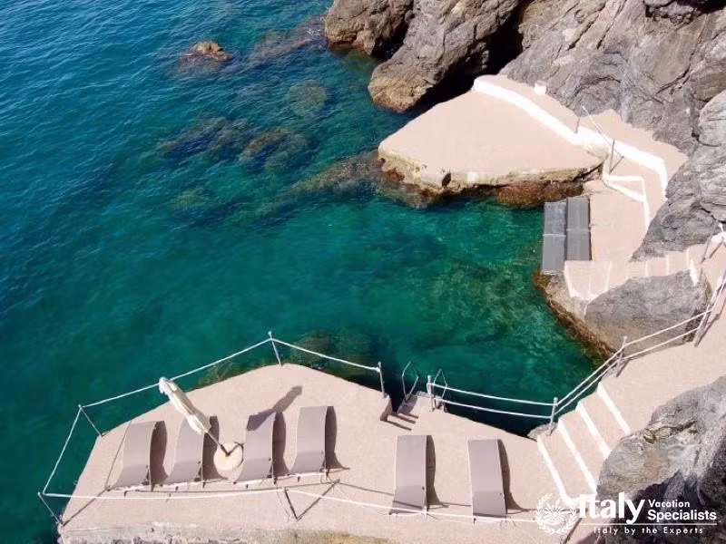 Private sun deck with access to clear waters.