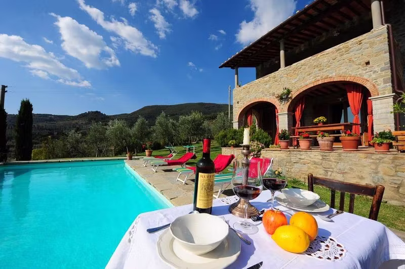 Enjoying a glas of wine at the swimming pool