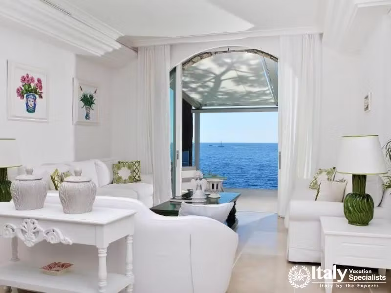 Bright living room with a direct ocean view.