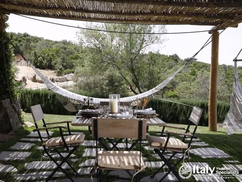 Outdoor sitting area in Villa Piera with hammock