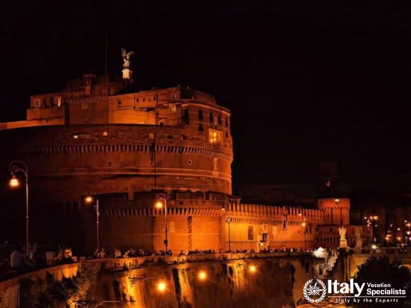 Marvel at the grandeur of Romes ancient castles illuminated at night.