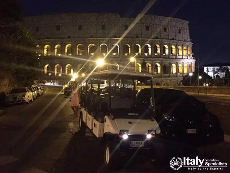 Golf Cart at Colosseum - Night ride past the illuminated Colosseum in a golf cart.