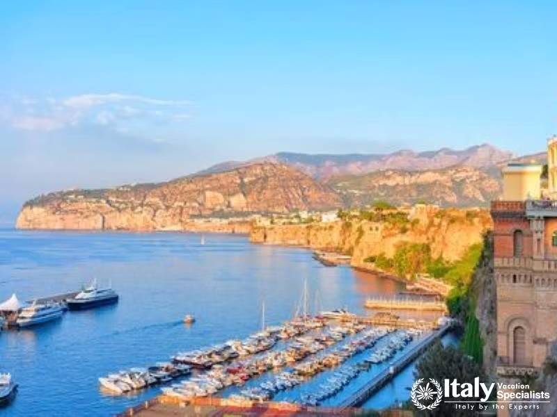 Boats sailing around Capris iconic Faraglioni rocks.