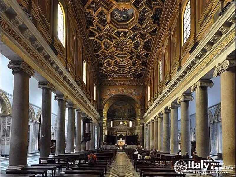 The magnificent interior of Santa Maria Maggiore, showcasing intricate architecture.