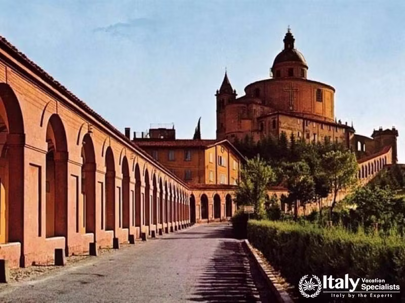 The Basilica of San Luca, perched on a hill, is connected to Bologna by a long, historic portico.