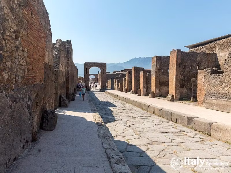 Pompeii, Italy - June 15, 2017 An ancient cobbled street in the ruins of Pompeii, Italy. Roman town 